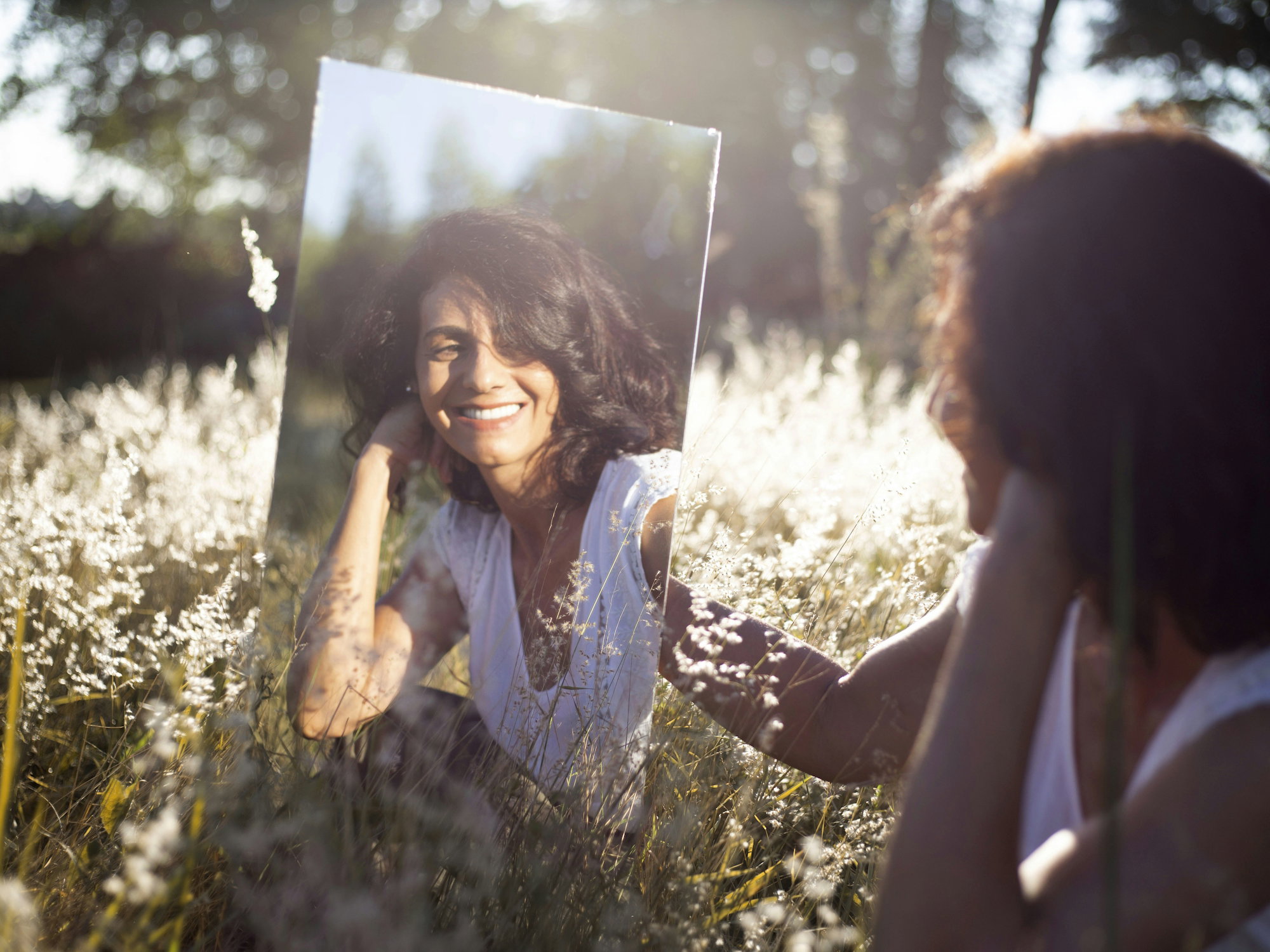 woman-in-blue-and-white-floral-shirt-holding-her-face.jpg woman in blue and white floral shirt holding her face